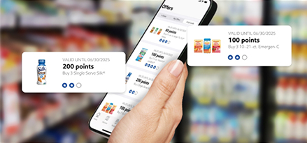 A hand holds a phone showing the Club Cards offers on-screen, with 2 of the offers popped out.